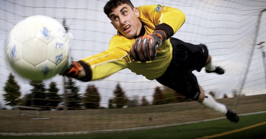 Soccer Goalkeeper - Man Catching Soccer Ball on Field