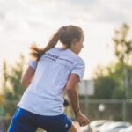 Soccer Fitness - A Woman Playing Soccer in the Field